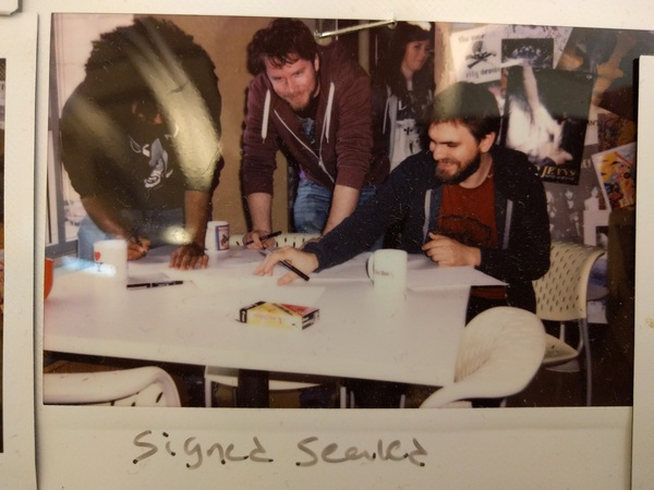 "Signed Sealed." Photo of a polaroid.